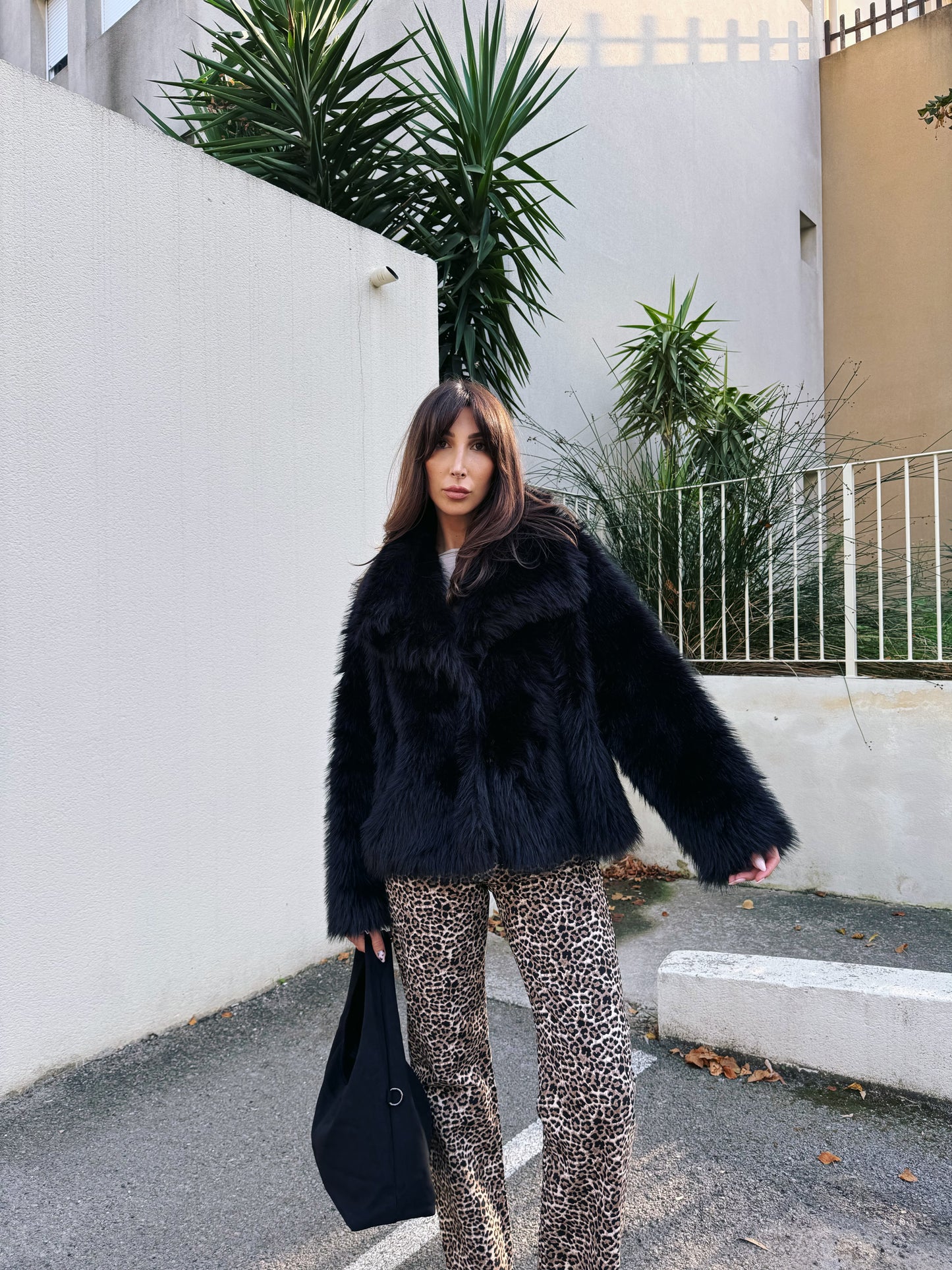 Manteau fausse fourrure noire