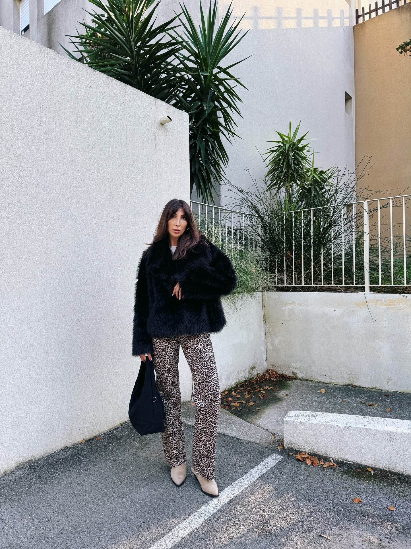 Manteau fausse fourrure noire