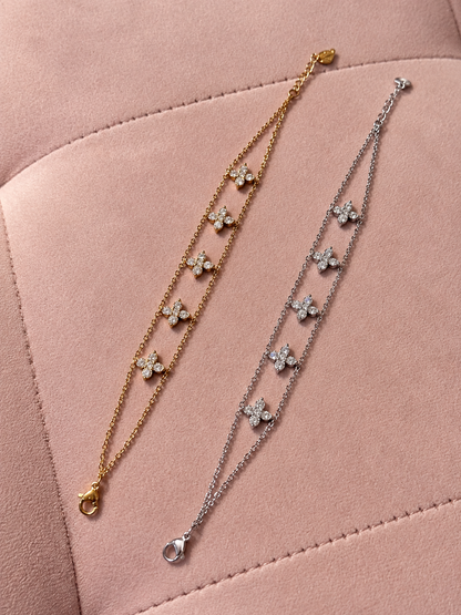 Bracelet double chaîne avec trèfles à 4 feuilles