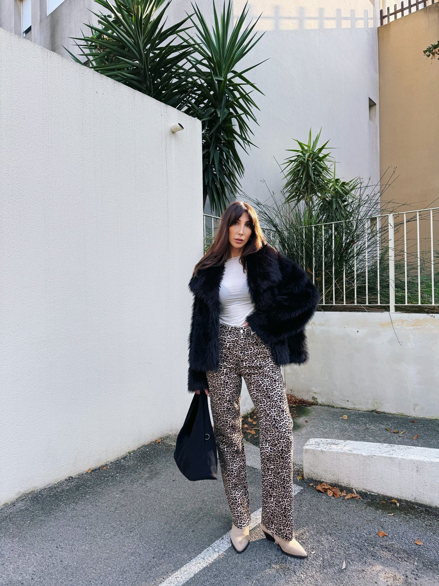 Manteau fausse fourrure noire